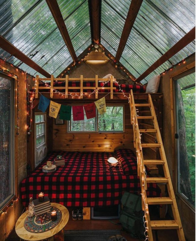 11 Awesome Garden Treehouse Ideas for You (and Your Kids) 8 a rustic treehouse with a clear roof and cosy wooden bunkbeds inside