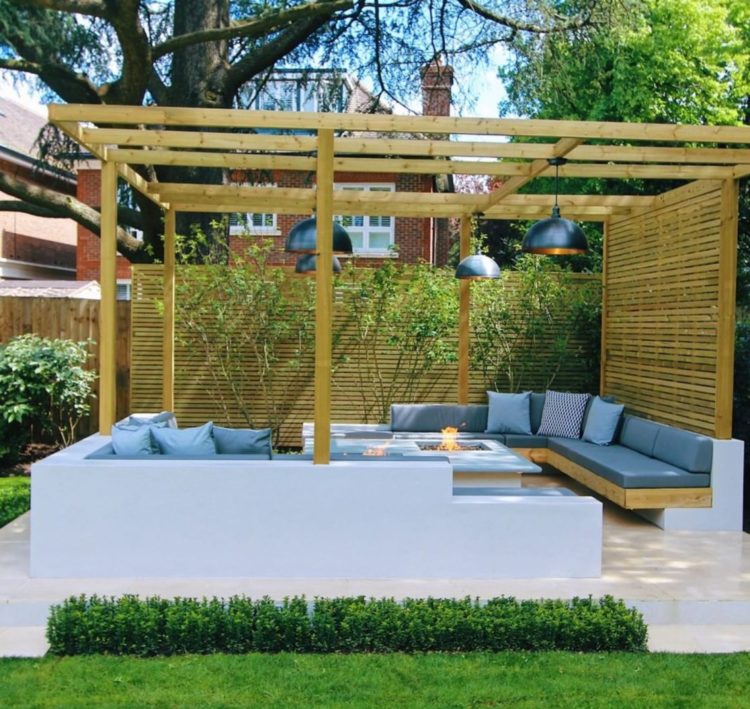 18 Garden Gazebo Ideas for an Outdoor Shelter from the Sun 16 a contemporary pergola with a concrete seating area and privacy screen