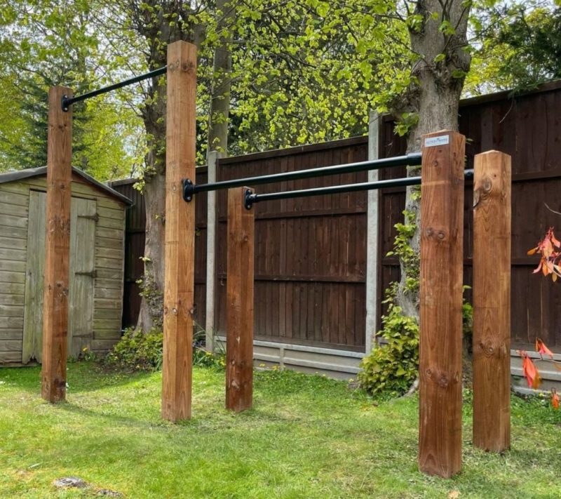 multi-purpose exercise bars installed in a garden gym
