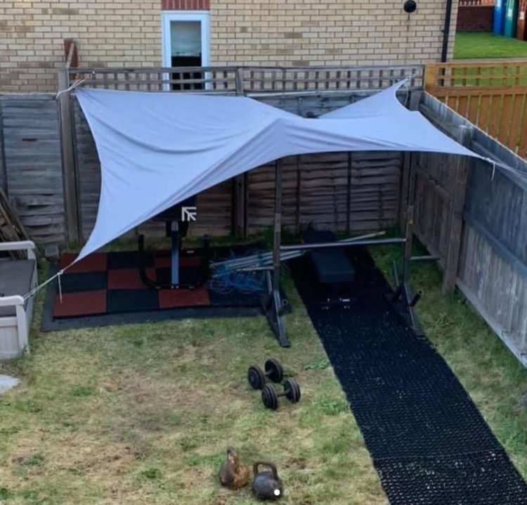 a tarpaulin covers an outside exercise area