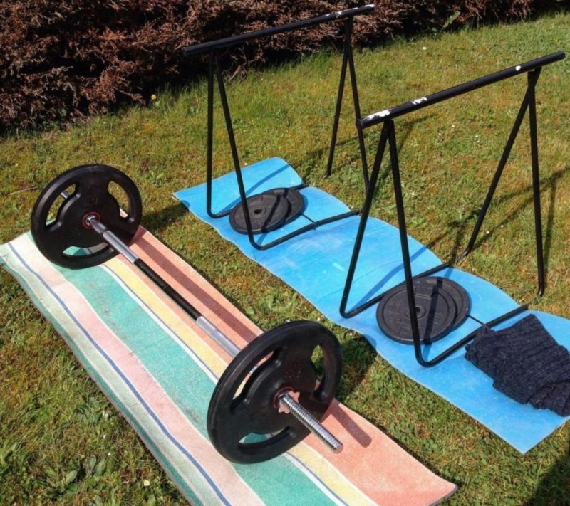 garden gym ideas include simple set ups like free weights on shock absorption mats on the lawn