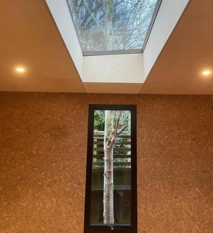 garden office ideas using strategically placed windows to make outside look like artwork