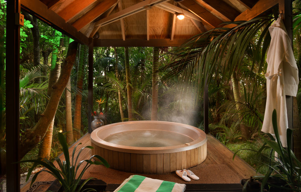 hot tub under a pagoda sitting in the palm forest