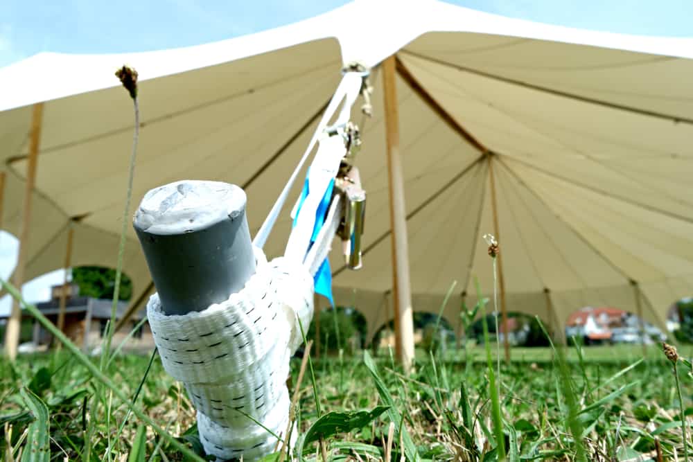 tent pegs and rope to secure a gazebo in the wind