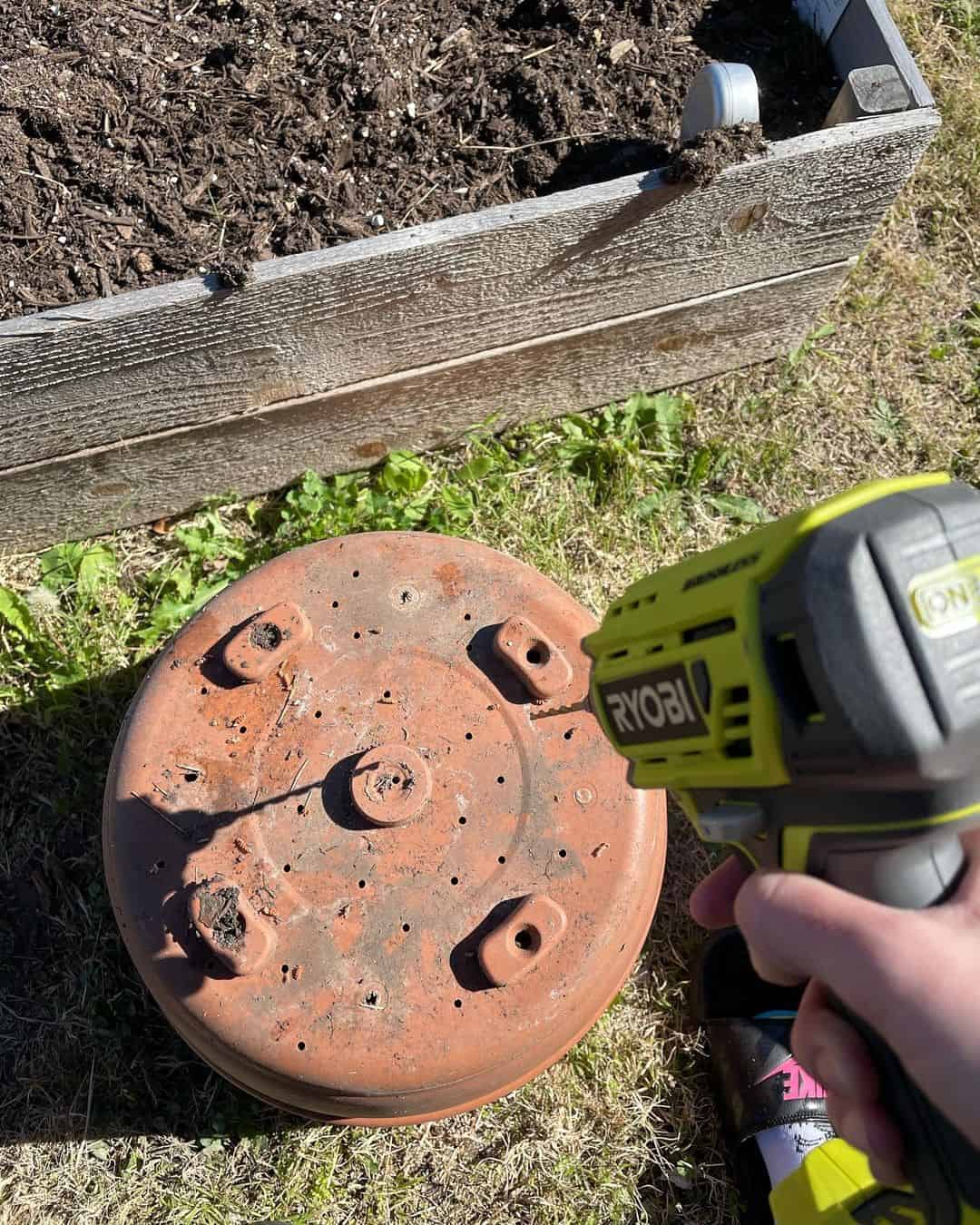 drill drainage holes in a pot