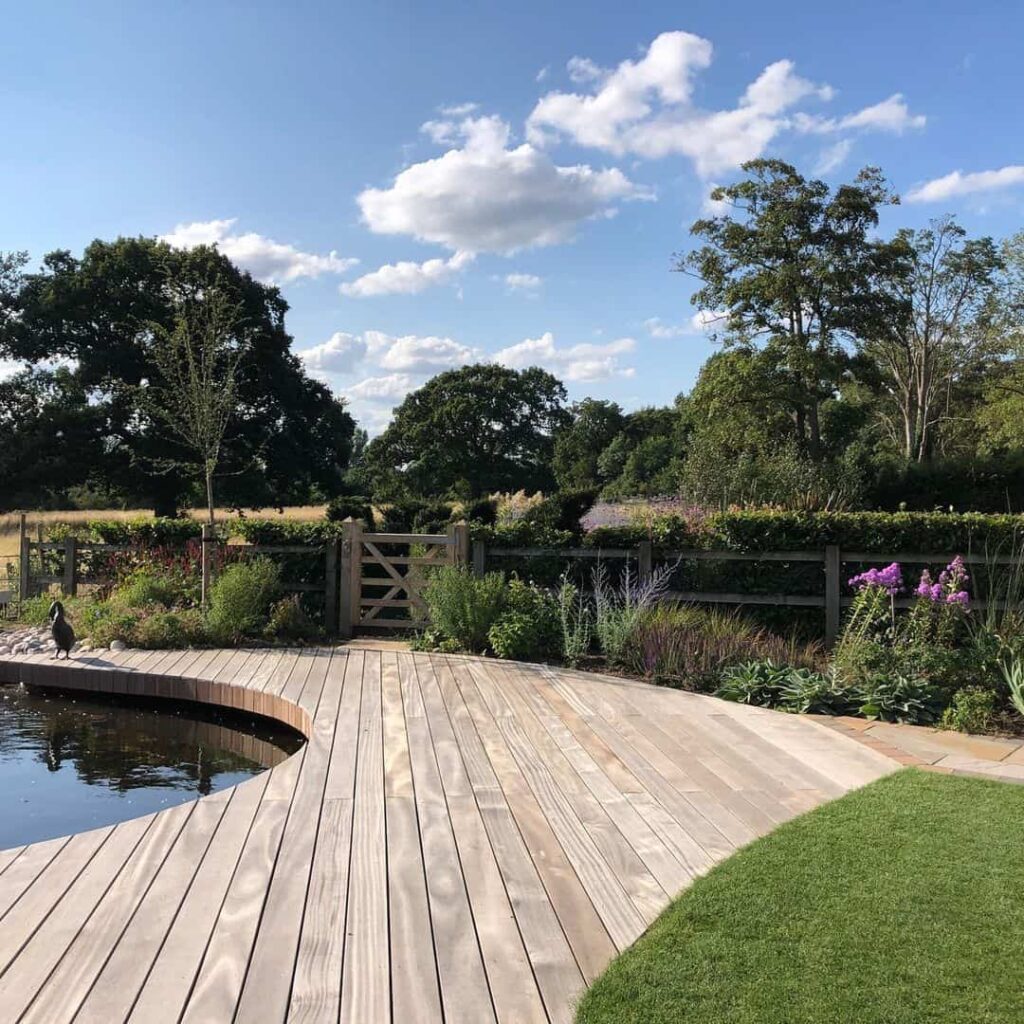 curved decking around a pond