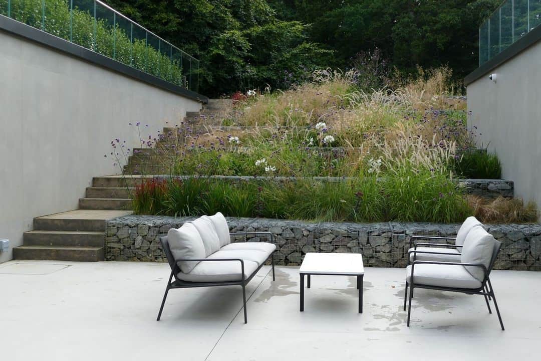 Sloped Garden Ideas: 15 Ways to Work With a Gradient in Your Garden 7 gabion wall sloped garden