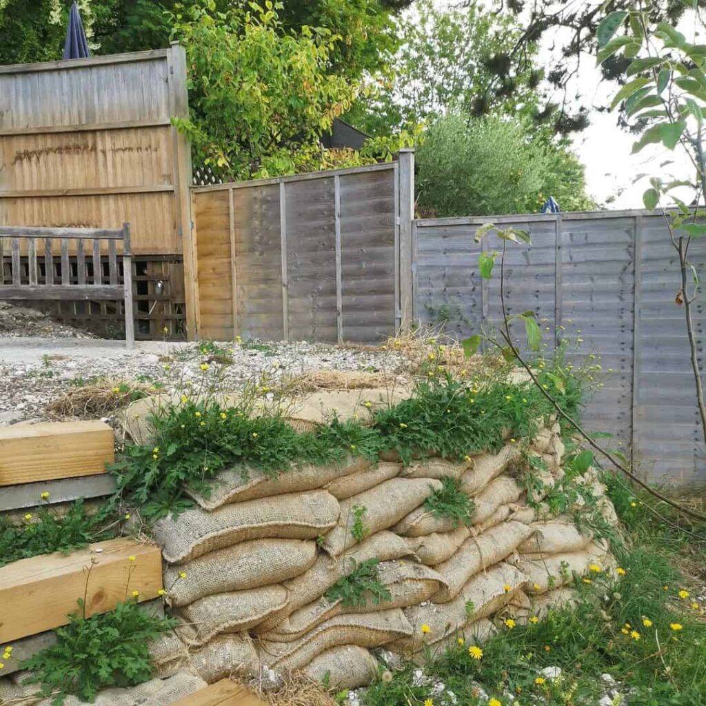 Sloped Garden Ideas: 15 Ways to Work With a Gradient in Your Garden 5 sandbag sloped garden