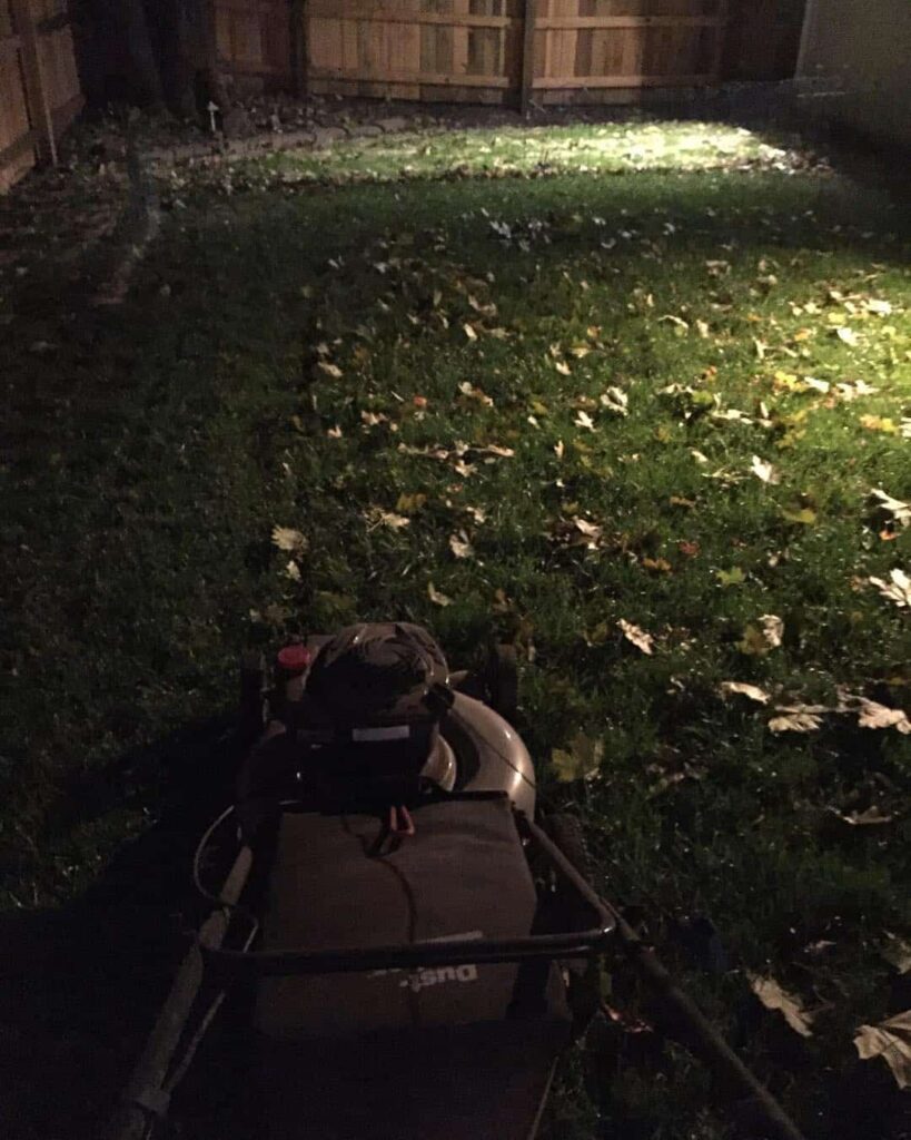 mowing the lawn after sunset